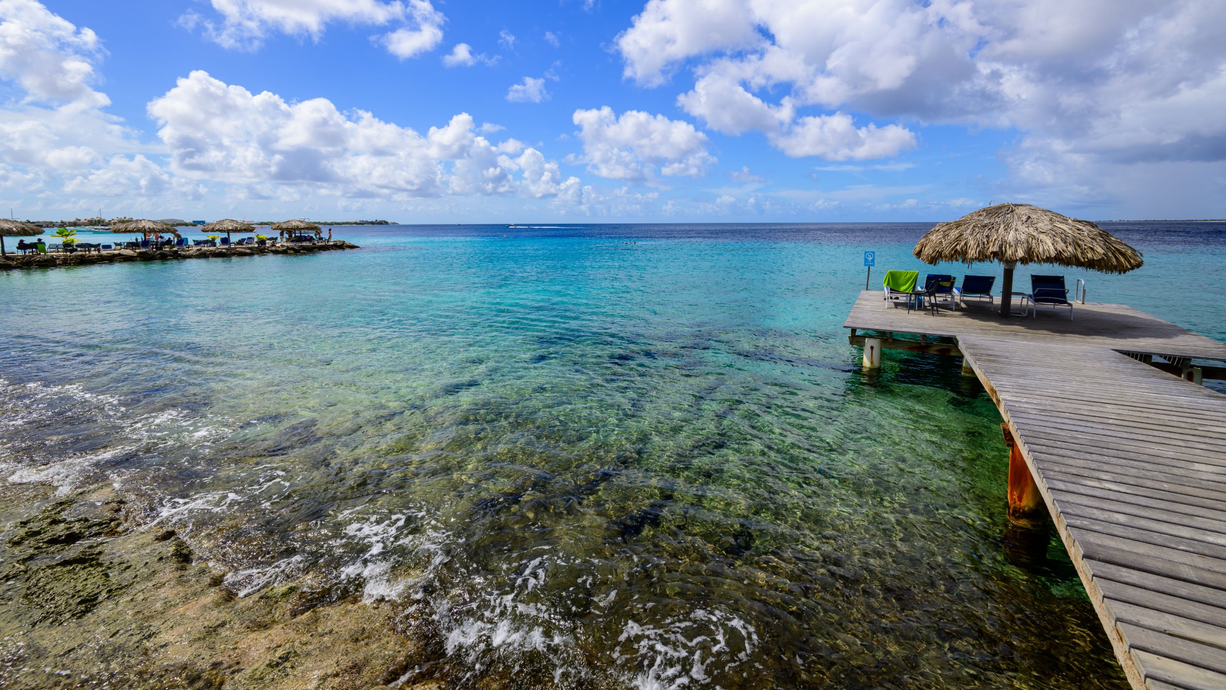 Wooden jetty over shallow reef water on the west coast of Bonaire